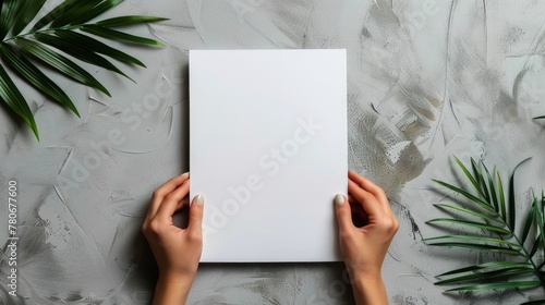 A person holding blank A4 paper in front of table. Generate AI image