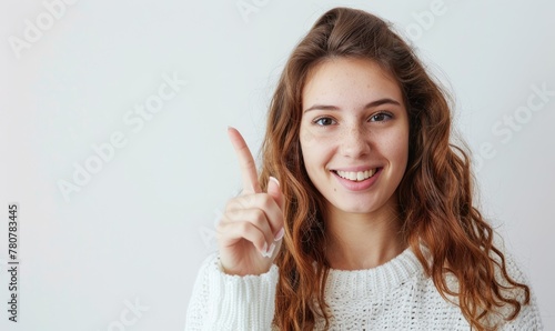 A happy female showing number one with her finger