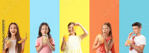 Group of little children with healthy fruit juices on color background