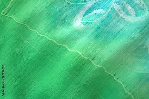 Green fabric with transversal fibers, horizontal abstract background