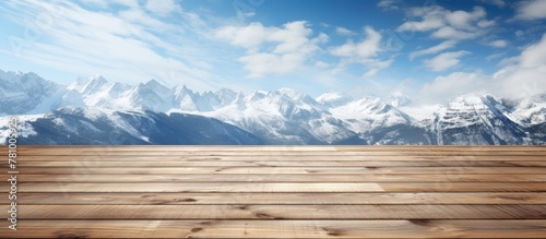 Scenic view from indoors featuring a wooden floor with a backdrop of majestic mountains in the distance