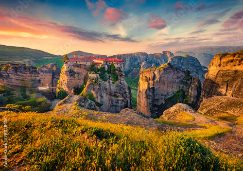 Astonishing summer view of popular tourist destination - Eastern Orthodox monasteries listed as a World Heritage site, built on top of rock pillars. Spectacular morning scene of Kalabaka, Greece.