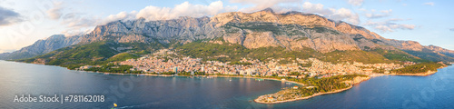 Aerial view of the town of Makarska, Dalmatia, Croatia. Summer landscape with yachts, sea, architecture and rocks, famous tourist destination at Adriatic seacoast, travel background, large panorama
