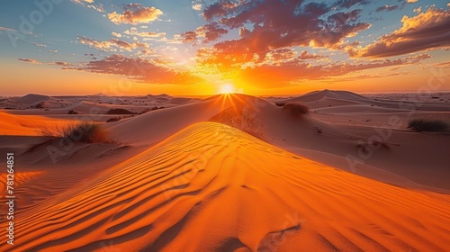 A pristine beauty of the Sahara Desert at sunrise With shifting sand and a golden glow.