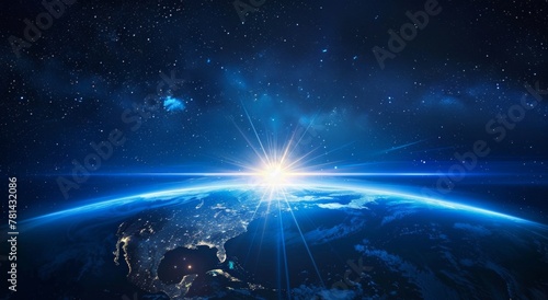 Planet earth seen from a satellite in the space and sunlight appearing in the background for blue hour