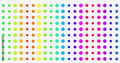 Artistic rainbow colored dots arranged on a white background. pattern with circles.