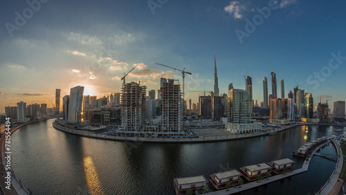 Dubai city center at sunset near river aerial timelapse