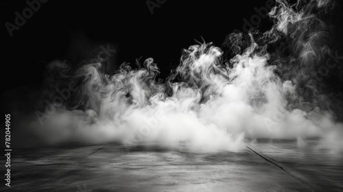 Mysterious smoke on dark background in monochrome
