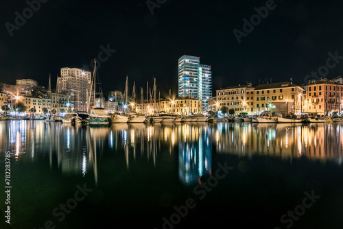 The medieval Savona harbor, with its old and new towers at night.