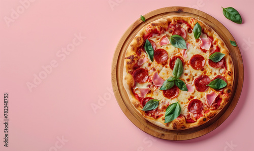 pizza on the wooden board, top view, on pastel pink background