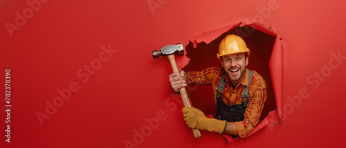 Optimistic worker popping through yellow wall Optimistic worker popping through yellow wall Optimistic worker with thumbs up emerging from bright red paper wall, wearing helmet and coveralls