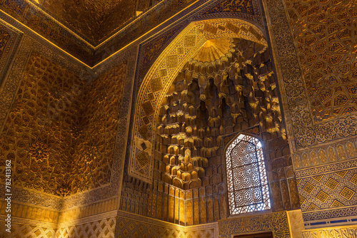 Inside the Gur-e-Amir mausoleum, deep niche and diverse muqarnas decoration