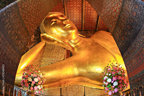 The Long Reclining Buddha (Phra Buddhasaiyas) in Wat Pho, One of the largest Buddha statues in Bangkok. Thailand 