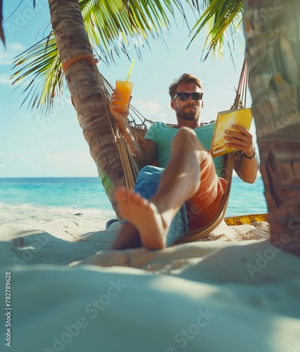 Boy on a paradisaical beach reading a book and drinking juice in summer