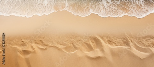 Wave approaching sandy beach