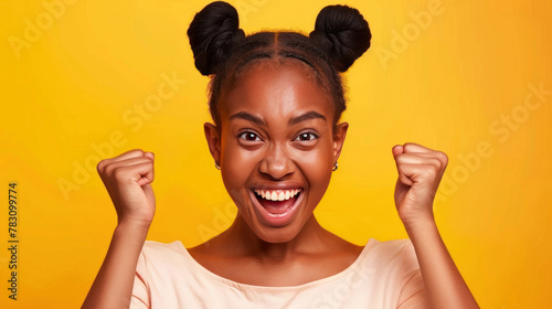 Radiating joy and victory, a young girl with expressive eyes and a bright smile