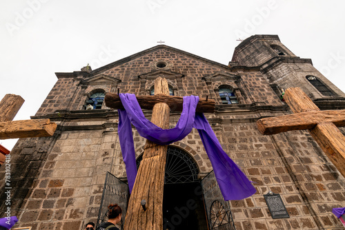 Binangonan, Rizal, Philippines - Crosses readied for Good Friday procession, in front of the facade of the Sta. Ursula Parish Church.