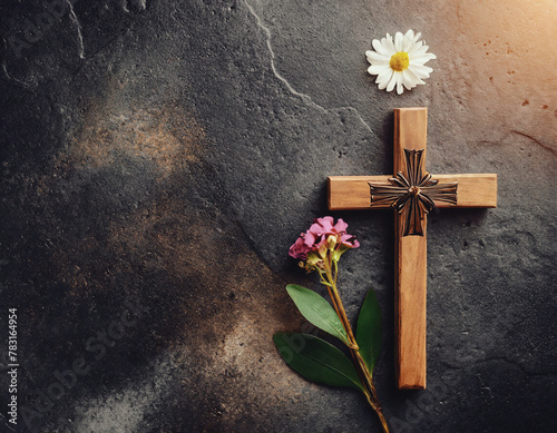 Wooden cross with flowers on stone background, top view with space for text. 