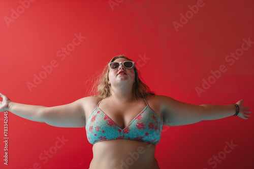 size plus model in bikini on red background, body positive lady (2)