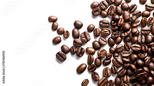 Roasted coffee beans scattered on a white surface, with shadows and highlights.