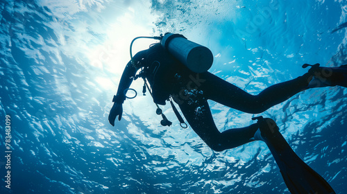  A man is diving underwater with a scuba tank