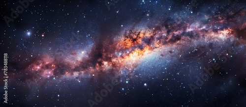 This image displays a stunning galaxy filled with shimmering stars and a luminous blue center that stands out in the cosmic expanse