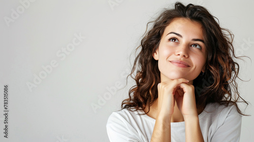 A happy woman contemplating a joyful thought
