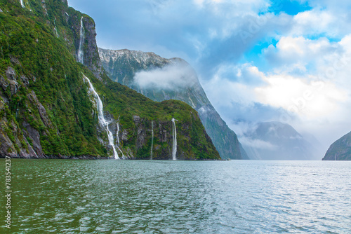 Photograph of Water Falls after very heavy rain and cold weather in Milford Sound in Fiordland National Park on the South Island of New Zealand