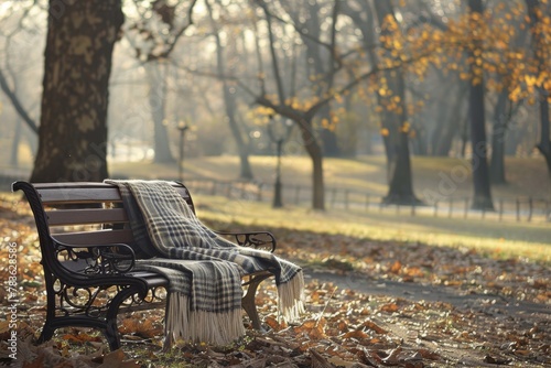 Quiet Park Bench with a Folded Blanket and Personal Possessions, Suggesting Solitude and Transience.