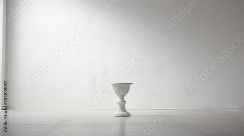 Pedestal with classic column shape in empty white room.