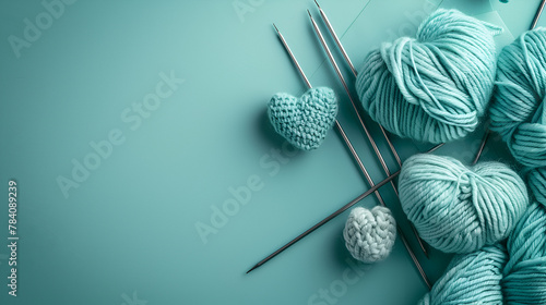Various wool yarn knitting needles and stuffed heart