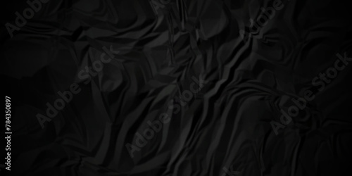 Dark black crumple paper wrinkled poster template ,blank glued creased paper texture background. black paper crumpled backdrop background. used for cardboard. 