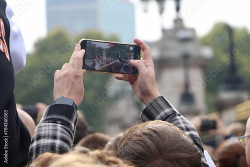 View of people taking photos and videos of different attractions