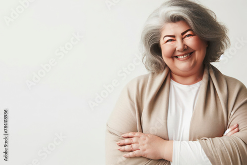 plus size old woman smiling on a white background copy space