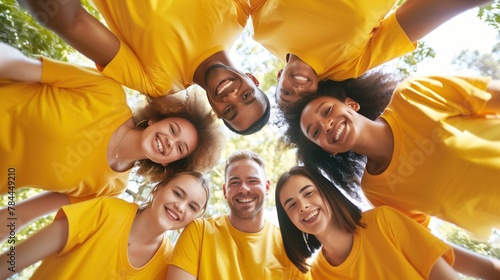 Volunteers in Yellow Shirts Forming a Circle