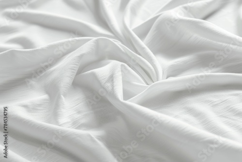 Close up view of a wrinkled white bed sheet with numerous folds and creases
