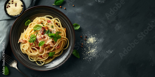 A dish of al dente spaghetti with bacon and basil on a black table. Copy space. Generative AI