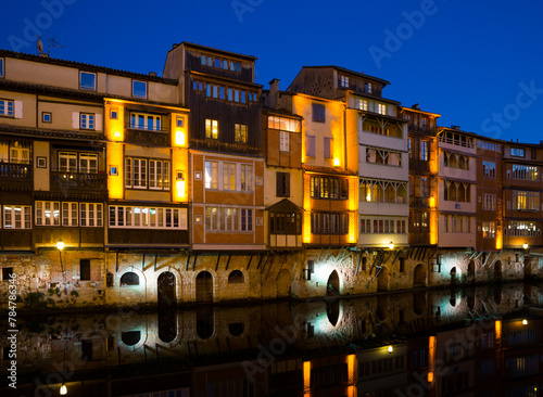 View of lighted old houses on Agout river, Castres, France