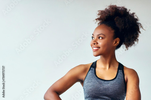 Portrait fitness afro black woman look side copy space in studio isolated on white background