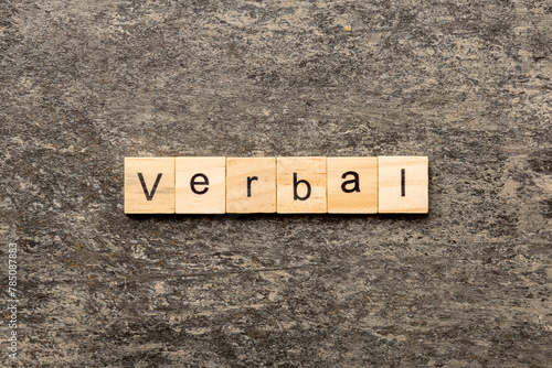 verbal word written on wood block. verbal text on table, concept