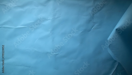 Abstract background with slightly wrinkled blue paper sheet.