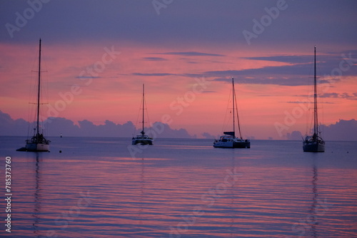 Some sailing boats at dusk, anchored on the lagoon. Rangiroa, Tuamotu archipelago, French Polynesia - November 10, 2022.