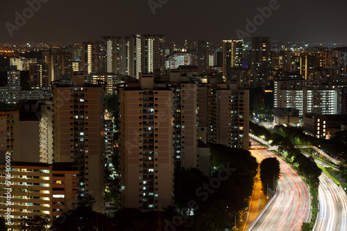 Toll road running through the condominiums of Novena in Singapore by night