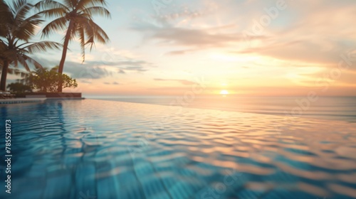 Blurred view of a luxurious hotel pool overlooking a paradisiacal beach at sunset with no one in the image 04
