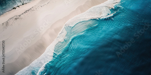 Surf line on the sea coast with white sand and turquoise water 
