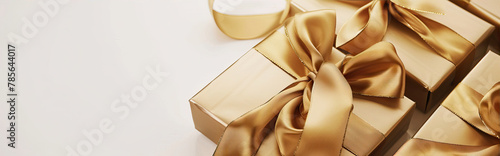 Golden gift boxes with bows on white background 