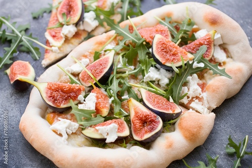 Fall flatbread pizza with fresh figs, arugula and goat cheese