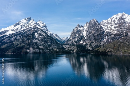 View of Lake Jenny and mountains with snowy peaks. Grand Teton National Park, Wyoming, USA.