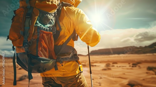 Adventurer adjusting solar backpack in desert, harsh sunlight, frontal closeup