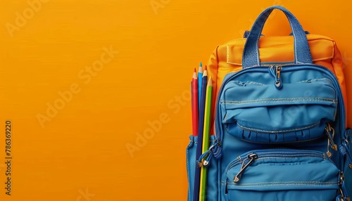 School bag essentials stationery supplies banner on orange background with space for text